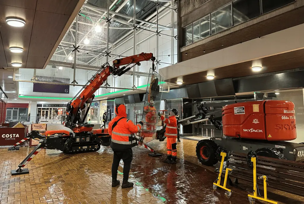 Structurally glazed roof and façade at shopping centre in Sutton Coldfield where toughened laminated glass panels were replaced